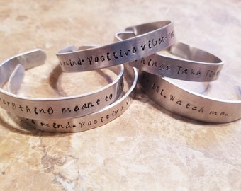 Custom hand stamped aluminum metal cuff bracelets