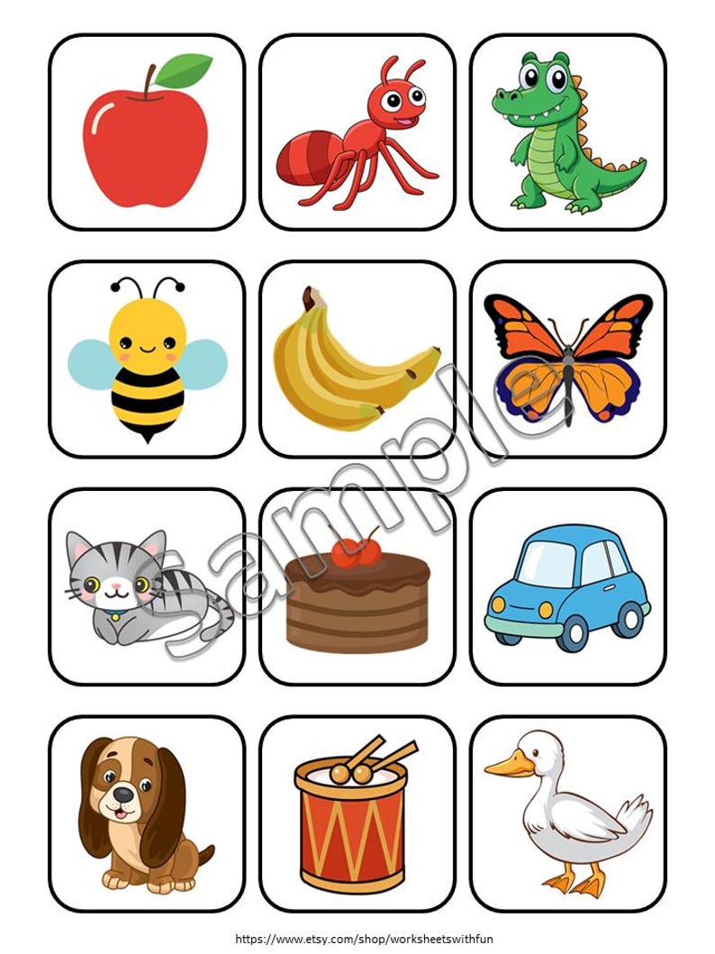 May include: A grid of twelve square cards featuring colorful cartoon illustrations of an apple, ant, crocodile, bee, banana, butterfly, cat, chocolate cake, blue car, dog, drum with sticks, and a white duck, all enclosed in black rounded borders.