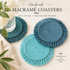 May include: Handmade macramé coasters in shades of teal and blue. The coasters are round with a fringed edge. The image includes text that reads "Handmade Macramé Coasters", "100% Cotton", and "Multiple Size Options".