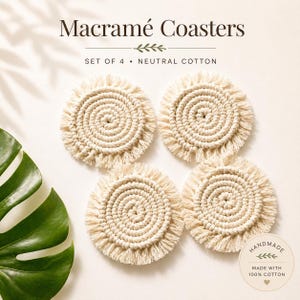 May include: Four neutral cotton macramé coasters with a circular design and fringed edges. The coasters are handmade and made with 100% cotton. The image includes the text "Macramé Coasters" and "Set of 4".