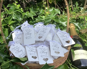 35 empty white organza favour bags + tags “ thankyou for being a key part in our lives “ fill with your own sweet treats etc