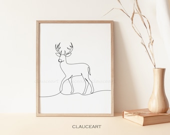 May include: A black and white line drawing of a deer with antlers, in a simple minimalist style. The drawing is framed in a light wood frame and is hanging on a white wall.