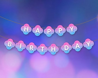 May include: A festive banner with the words "HAPPY BIRTHDAY" spelled out in white letters. Each letter is on a clover-shaped decoration with pink and blue gradients, strung on a thin gold string against a blurred background.