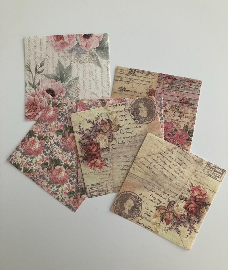 May include: A set of six vintage-style paper squares with floral and letter designs. The papers feature a faded, antique aesthetic with roses, handwritten script, and postage stamps.