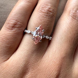2.40 carat pink marquise lab grown diamond engagement ring with marquise-round diamond band in gold