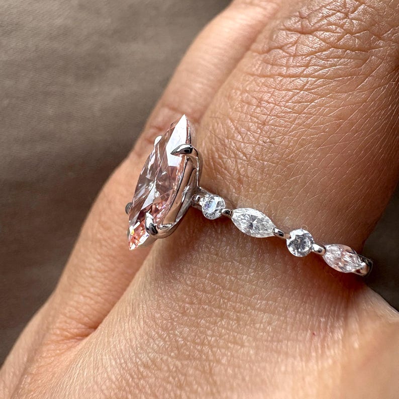 2.40 carat pink marquise lab grown diamond engagement ring with marquise-round diamond band in gold