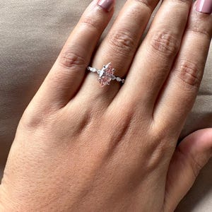 2.40 carat pink marquise lab grown diamond engagement ring with marquise-round diamond band in gold