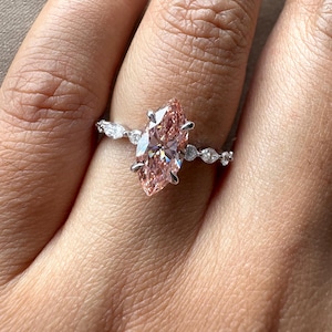 2.40 carat pink marquise lab grown diamond engagement ring with marquise-round diamond band in gold