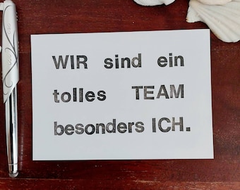 Postcard saying "We are a TEAM..." A6 fun at work greeting card humor card office black white gift for colleagues