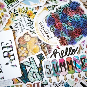 May include: A collection of colourful stickers with different designs and phrases, including "Hello Summer", "Be Anxious for Nothing", and "How Dren Rise Up Call Her Blessed".