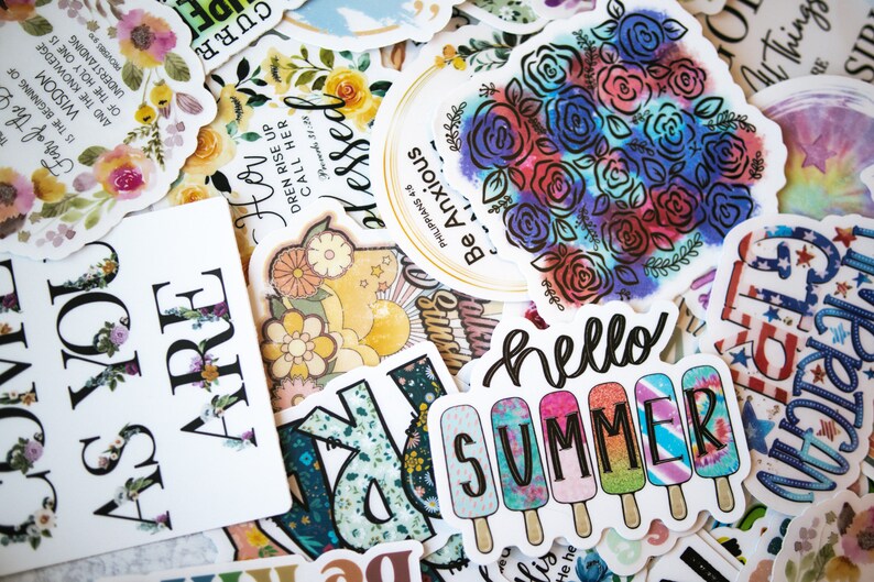 May include: A collection of colourful stickers with different designs and phrases, including "Hello Summer", "Be Anxious for Nothing", and "How Dren Rise Up Call Her Blessed".