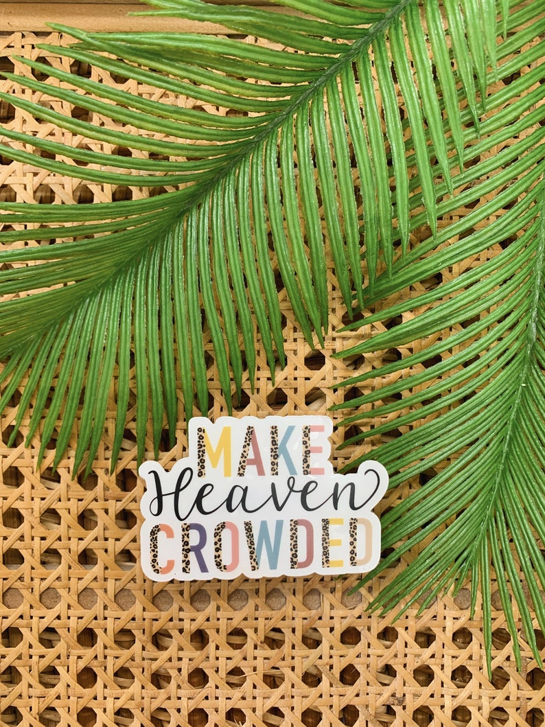 May include: A sticker with the text "Make Heaven Crowded" in colorful letters with a leopard print pattern.
