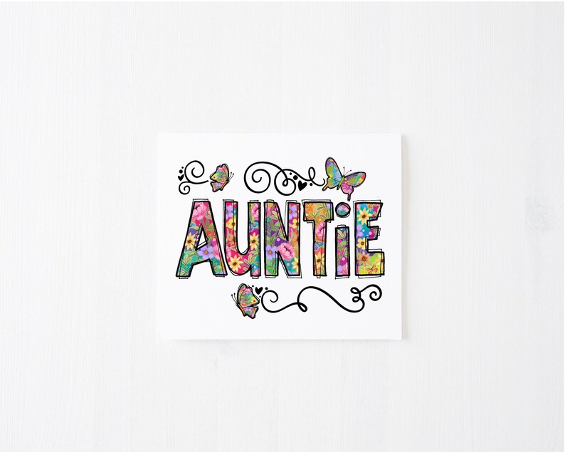 May include: A white card with the word "AUNTIE" in colorful letters with a floral pattern. The word is surrounded by butterflies and swirls.