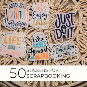 May include: 50 colorful stickers with inspirational quotes, perfect for scrapbooking. The stickers feature phrases like "And so the adventure begins", "Life is a journey", "Just do it", and "Your limitation is only your imagination".