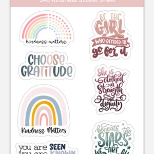 May include: A sheet of 6 colorful stickers with positive messages. The stickers feature rainbows, stars, and handwritten text. The text includes "kindness matters", "choose gratitude", "be the girl who decided to go for it", "she is clothed in strength and dignity", "you are seen, known, loved, wanted", and "beneath the stars we are all dreamers".
