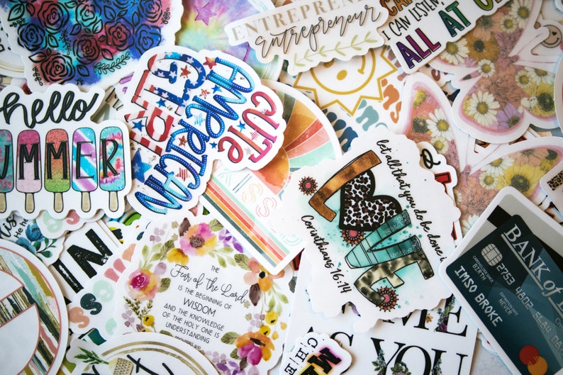 May include: A collection of colourful stickers with various designs and phrases, including "Hello Summer", "Let all that you do be done in love", "Fear of the Lord is the beginning of wisdom", and "Cute as a button".