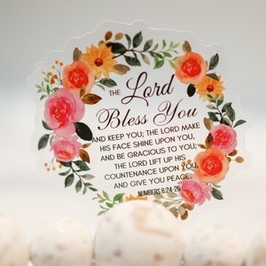 May include: A clear sticker with a floral wreath design and the text "The Lord Bless You" and a Bible verse from Numbers 6:24-26.