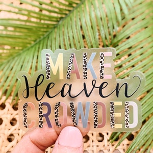 May include: A clear sticker with the text "MAKE HEAVEN CROWDED" in colorful letters with a leopard print pattern.