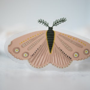 May include: A pink and white butterfly sticker with a green stem and black accents. The butterfly has a detailed pattern of lines and dots.