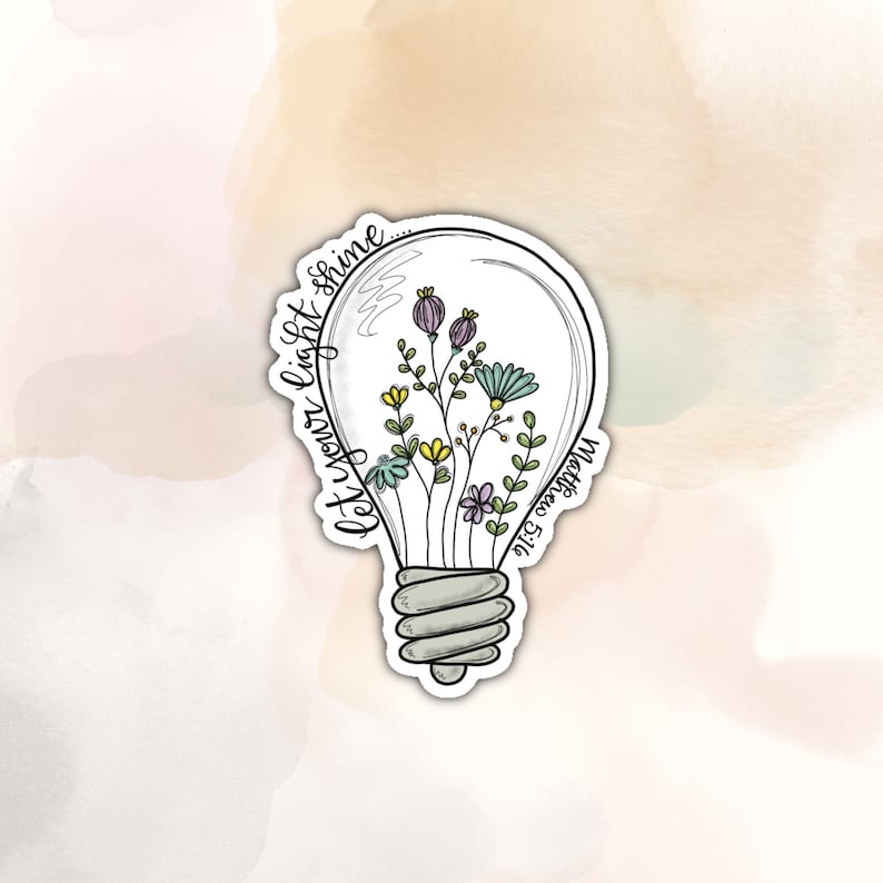 May include: A light bulb sticker with a quote "Let your light shine... Matthew 5:16" and a drawing of flowers inside the bulb.