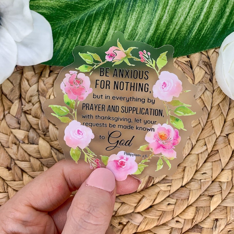 May include: A gold sticker with a floral design and the text "BE ANXIOUS FOR NOTHING, but in everything by PRAYER AND SUPPLICATION, with thanksgiving, let your requests be made known to God Philippians 4:6".