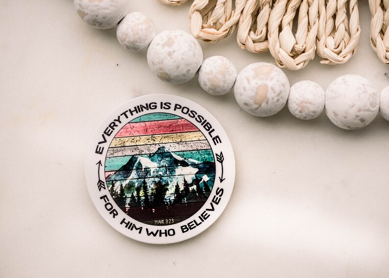 May include: A round sticker with a colorful mountain scene and the text "Everything is possible for him who believes" with the scripture reference "Mark 9:23".