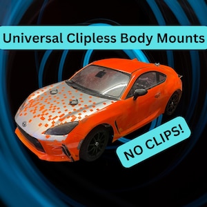 May include: An orange and silver toy car with black wheels. The car has the text "Universal Clipless Body Mounts" and "NO CLIPS!" on the image. The car is set against a blue and black background.