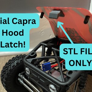 May include: A red Axial Capra RC car with the hood open, revealing the engine and electronics. The hood latch is visible, and the text "STL FILE ONLY" is written on a blue background.