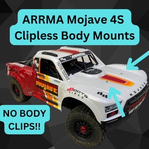 Peut inclure: Un camion radiocommandé blanc, rouge et orange avec les mots "ARRMA Mojave 4S" et "FASTER TOUGHER" sur le côté. Le camion a des roues noires et une cage de sécurité noire. Le camion est sur un fond noir. Le texte "NO BODY CLIPS!!" est dans le coin inférieur gauche de l'image.