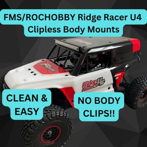 May include: A white and black RC car with a red and white body. The car has a roll cage and a light bar on the roof. The text "Ridge Racer U4" is printed on the side of the car. The text "FMS/ROCHOBBY Ridge Racer U4 Clipless Body Mounts" is printed at the top of the image. The text "CLEAN & EASY" is printed in a blue box on the left side of the image. The text "NO BODY CLIPS!!" is printed in a blue box on the right side of the image.