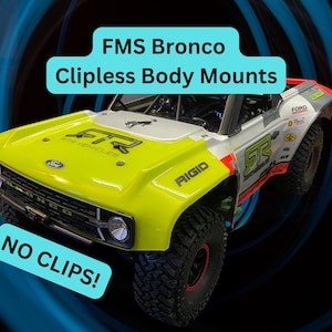 May include: A yellow, white, and red FMS Bronco model with black tires. The text "FMS Bronco Clipless Body Mounts" and "NO CLIPS!" are displayed. The model has the word "RIGID" on the side.