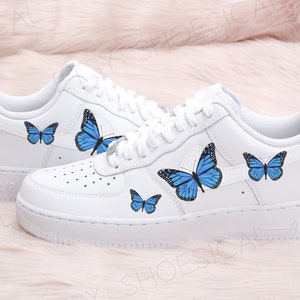 white air forces with blue butterflies