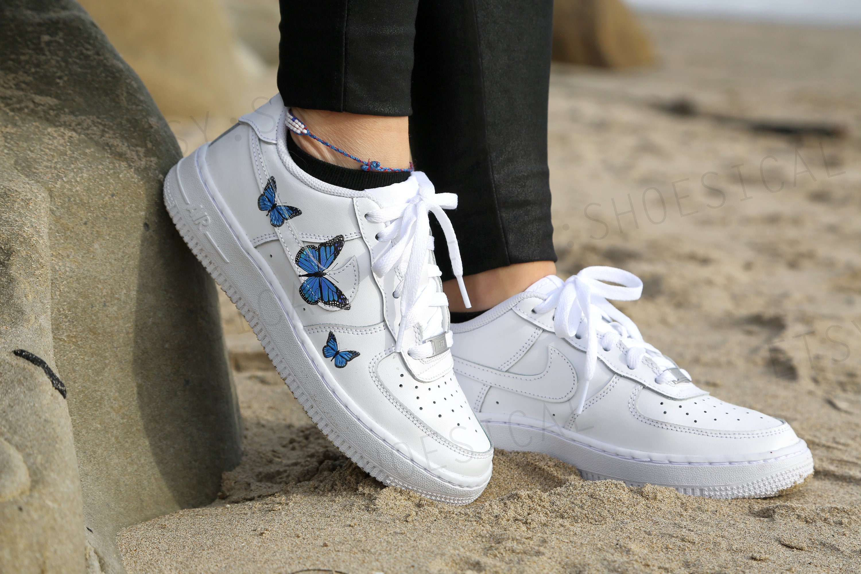 white nike air forces with blue butterflies