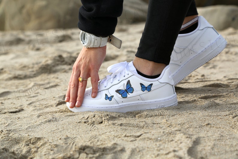 white air forces with blue butterflies