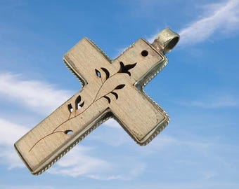 Hand-made natural wooden cross with coin silver frame. It has a hand-cut long Lilly design.