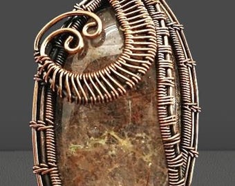 Rutilated Jasper pendant with fancy copper wire works.