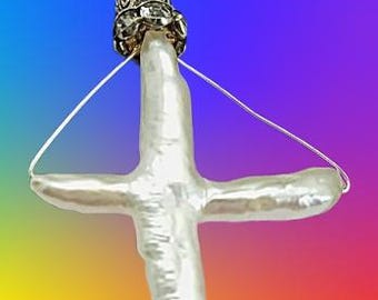 Straight from the Oyster: a Pearl cross. This is a cross which is uniquely rare.
