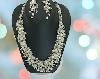 Freshwater Pearl necklace with crystals and sterling silver, with matching earrings.