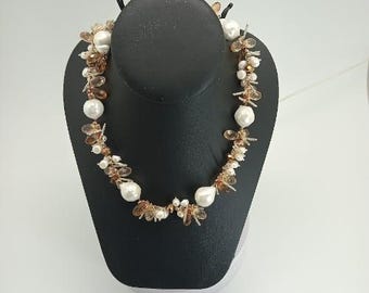 Freshwater pearl and crystal necklace is destined to become your favorite go-to accessory. Strung on luxurious silk,