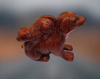 This NETSUKE piece is a vintage item, Mama dog and her baby