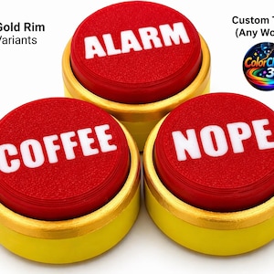 May include: Three novelty buttons with red tops and white text reading "ALARM", "COFFEE", and "NOPE". The buttons sit in yellow bases with gold rims. The image also includes text that says "Gold Rim Variants" and "Custom Text (Any Word)".