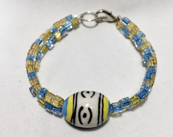 20-200 - 7 1/2" Two Strand Glass Bead Bracelet / Ceramic Focal Bead. From BrettyBracelets123