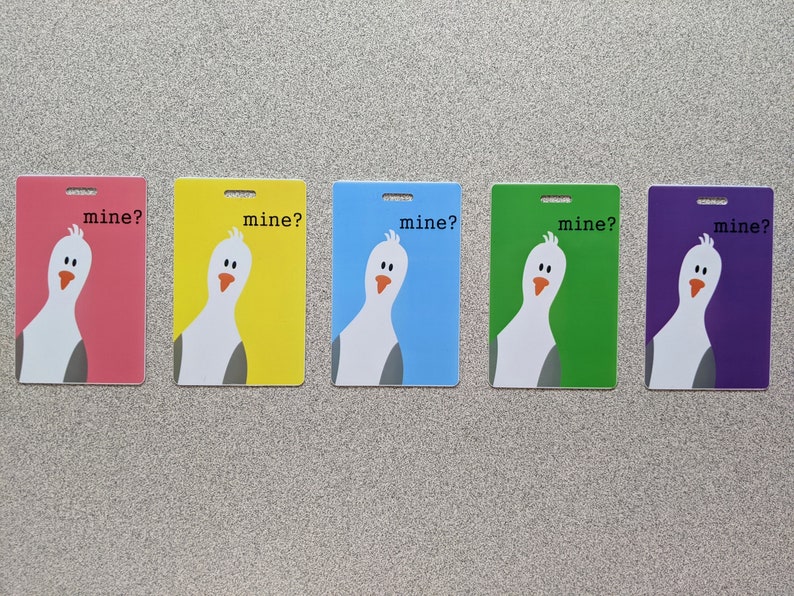 May include: Five colorful cards with a cartoon seagull on each. The seagull is white with a gray beak and gray eyes. The text on each card reads "mine?" in black text. The cards are pink, yellow, blue, green, and purple.