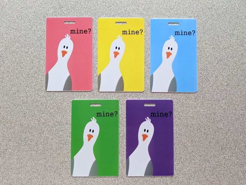 May include: Five colorful cards with a white cartoon bird on each. The bird is looking over its shoulder and the text "mine?" is printed on each card.