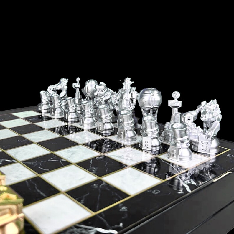 May include: A silver chess set with unique, futuristic-looking pieces on a black and white marble chessboard.