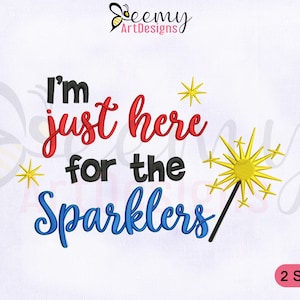 May include: Embroidered design with the text "I'm just here for the sparklers" in red, blue, and black lettering. The design includes a yellow sparkler with a black stick.