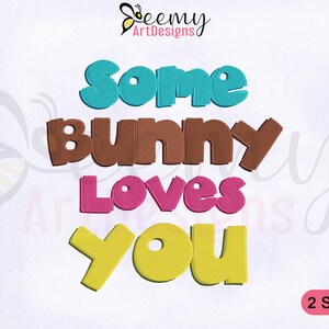 May include: Embroidered design featuring the text "Some Bunny Loves You" in colourful, playful lettering. The words are in different colours: blue, brown, pink, and yellow. The design is perfect for a baby's nursery, a child's room, or a gift for a special occasion.