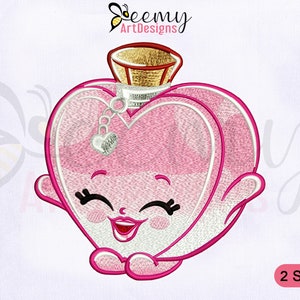 May include: Embroidered design of a pink heart-shaped perfume bottle with a smiling face and a gold lid. The design is available in two sizes.