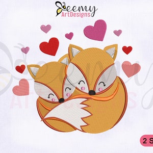May include: Embroidered design of two orange foxes hugging, surrounded by pink and red hearts. The design is available in two sizes.