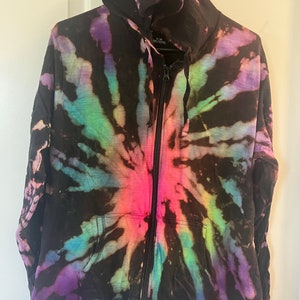 May include: Black tie-dye zip-up hoodie with a rainbow swirl pattern.